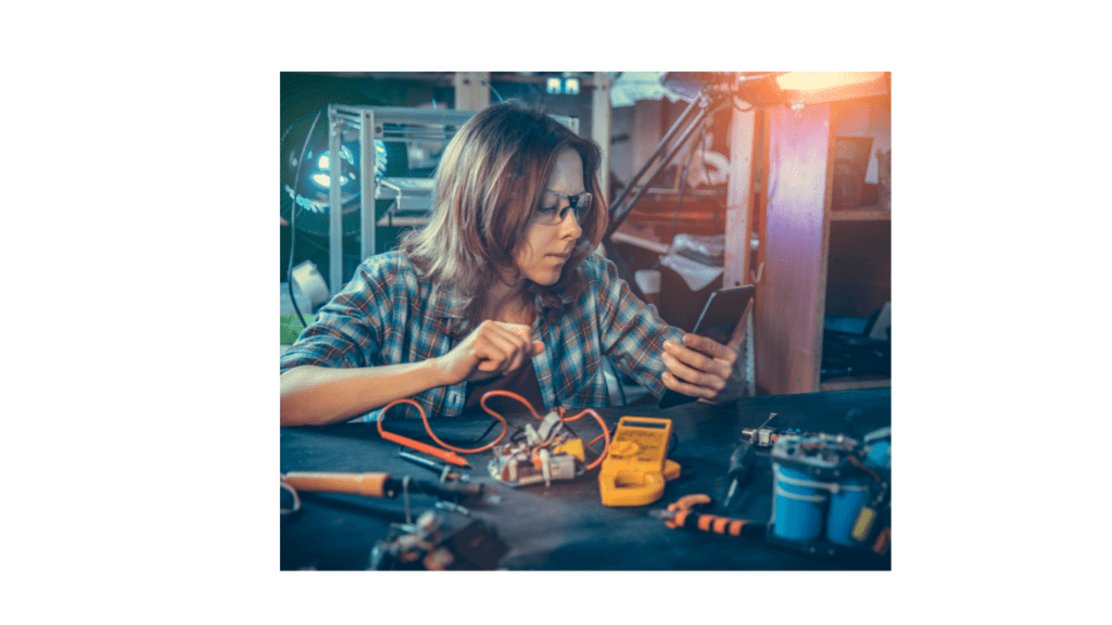 woman engineer in workshop at bench