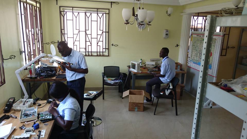 Alex Nii Nortey Dowuona, Biomedical Engineering Manager, in hospital work room with colleagues