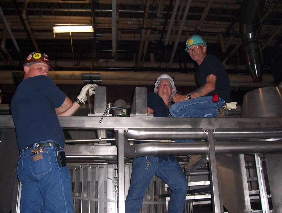 Jonathan Haymans and colleagues during an install working as field service equipment engineers