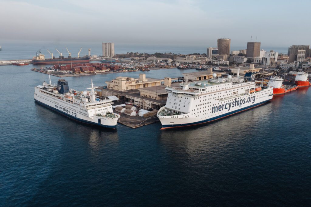 The Global Mercy docked next to the Africa Mercy shortly after arriving in Africa for the first time in Dakar, Senegal. This event also marked the first time both ships were in the same location.