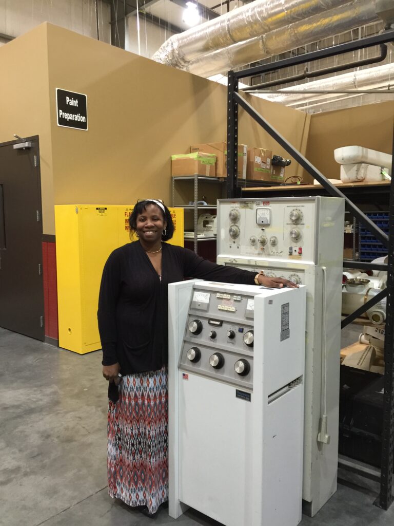 J.C. Newell with biomed equipment in warehouse