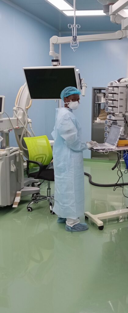 Ruth Otieno in ppe in hospital working on equipment