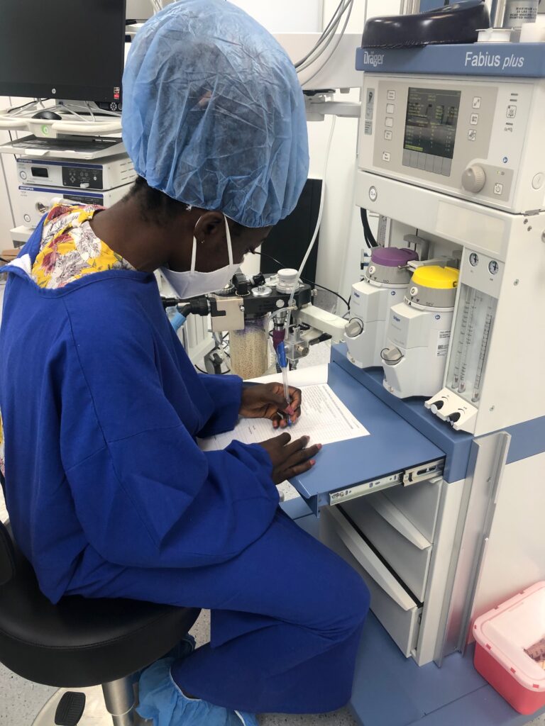 Yaa Amoakoa Frempong in lab writing report with Fabius equipment