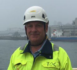 Gordon Foot at docks in hard hat and ppe