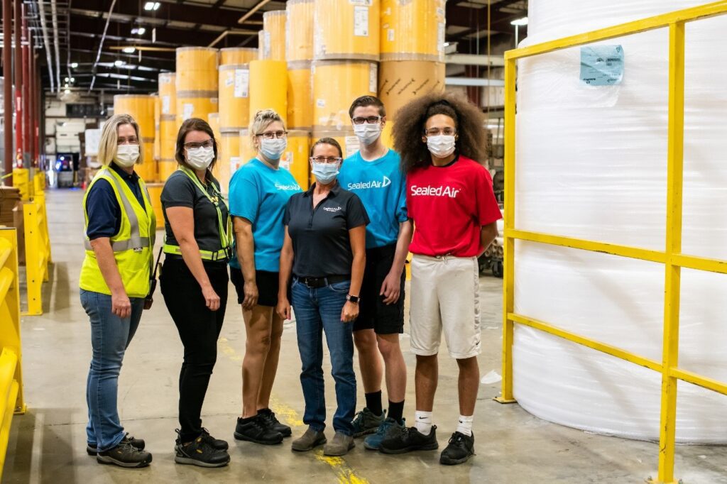 Group of Sealed Air employees in factory