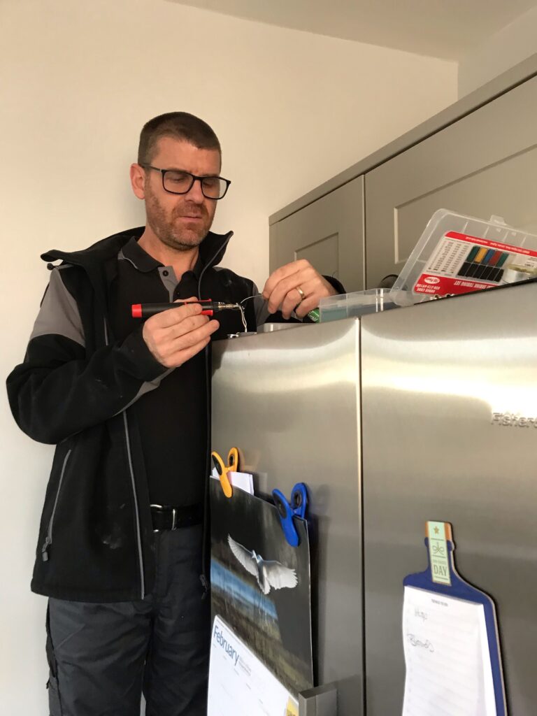 Paul Summerhayes  Field Service Technician Fisher and Paykel fixing electrical wiring