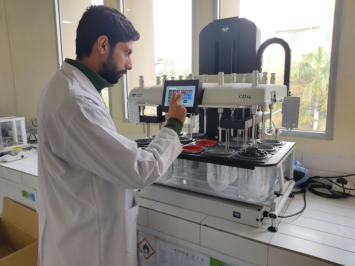 Ahmed Saad Chromatography Field Service Engineer in lab workng on equipment