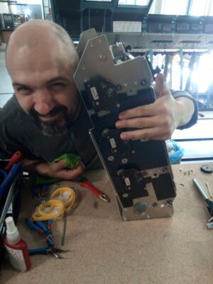 Dejan Mauka's colleague Sasha repairing a part in workshop