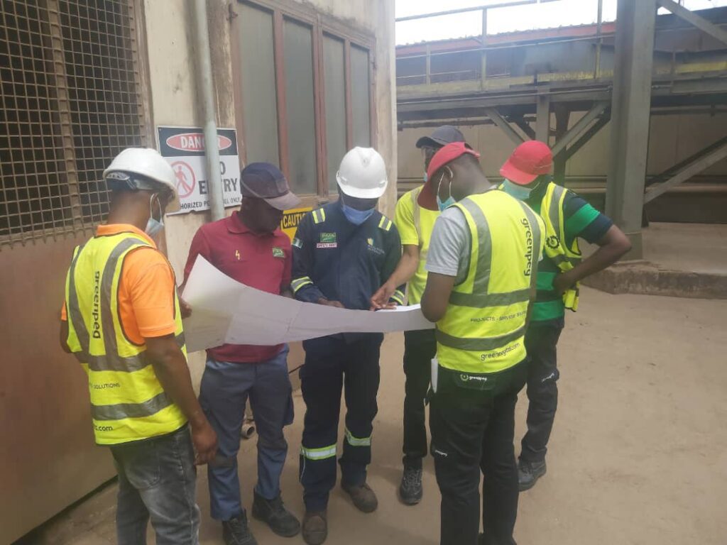 engineers checking site details for production line engineering