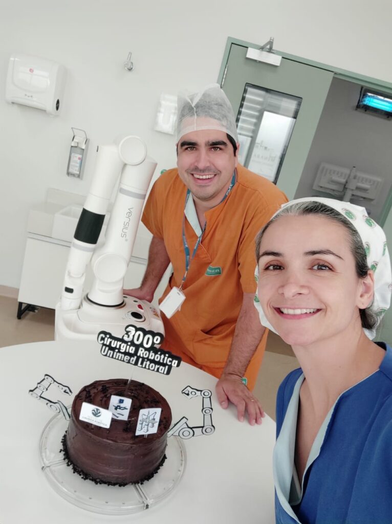 Juliano C. Ferreira with colleague and robot