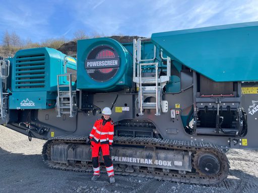 Katherine Evans Geotechnical Manager next to a crusher