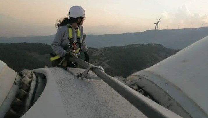 Songul Ogdum Power Plant Specialist Wind and Hydroelectric on rope on turbine