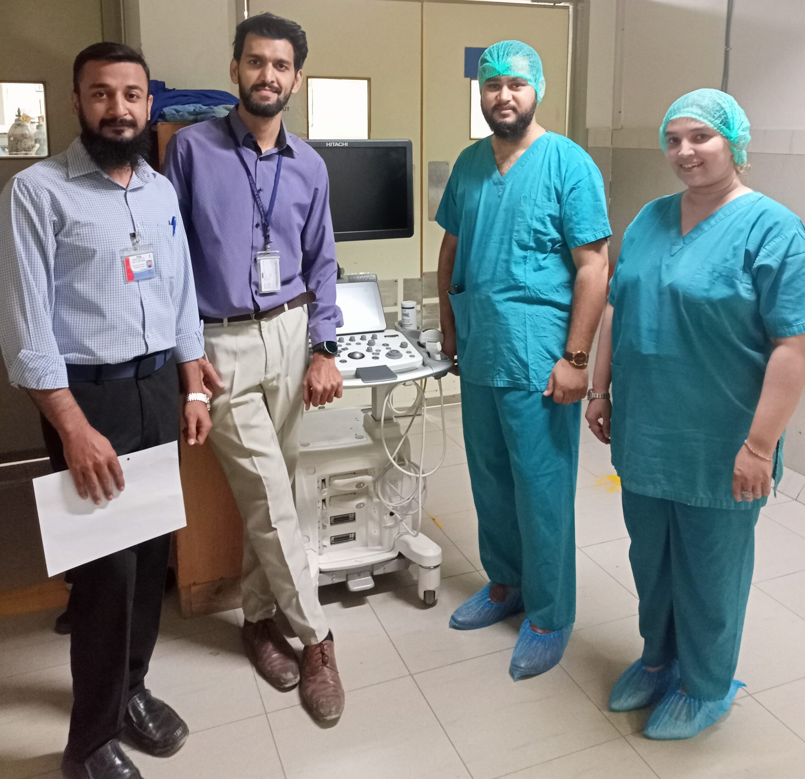 Syeda Ghazia working as a woman medical equipment engineer with colleagues