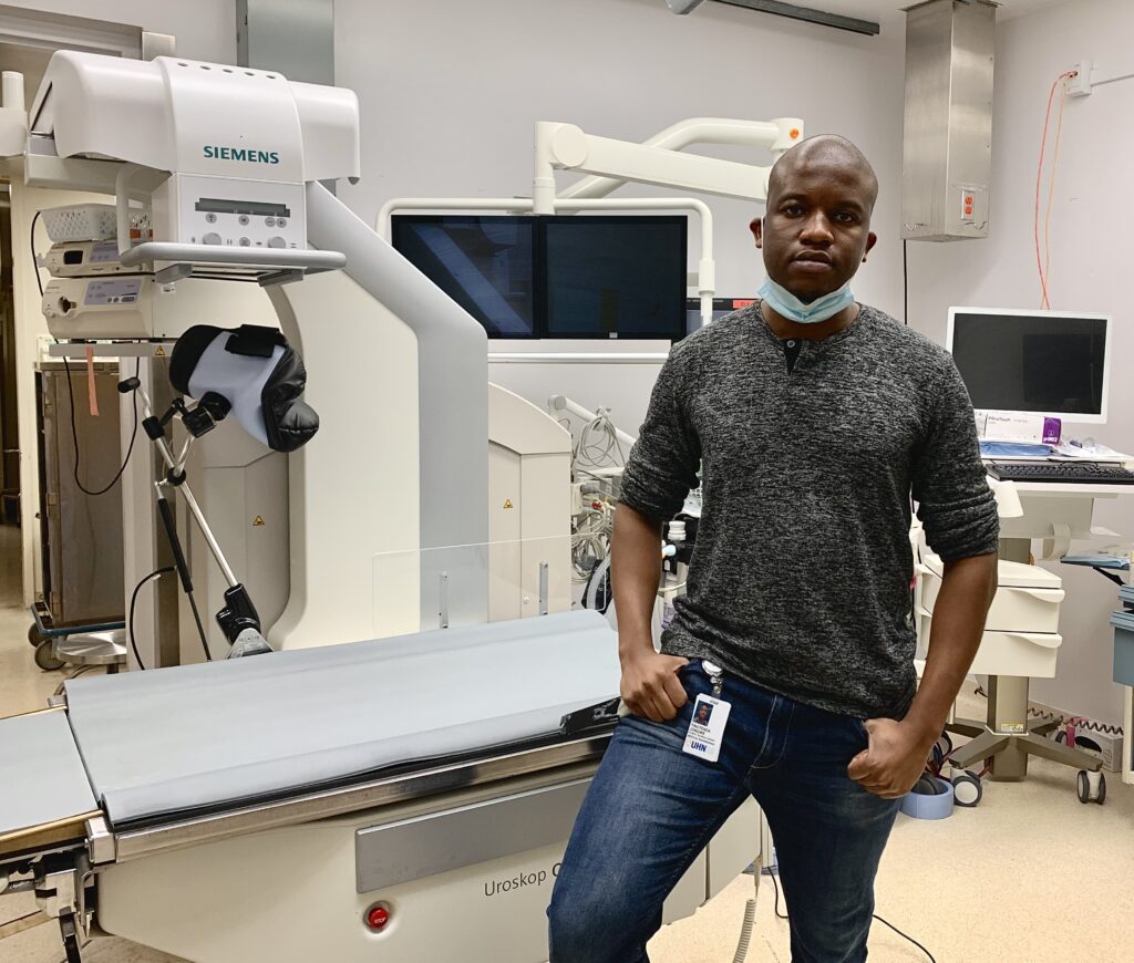 Tino Jongwe Biomedical Engineering Technologist at The Ottawa Hospital with scanner and computer