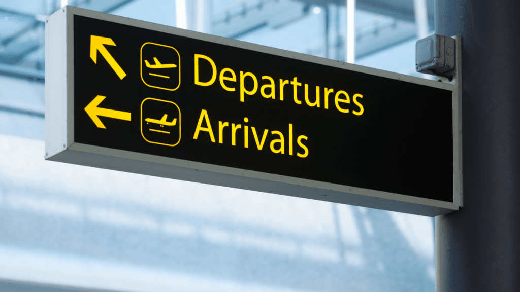 departures and arrivals sign for find work in another country