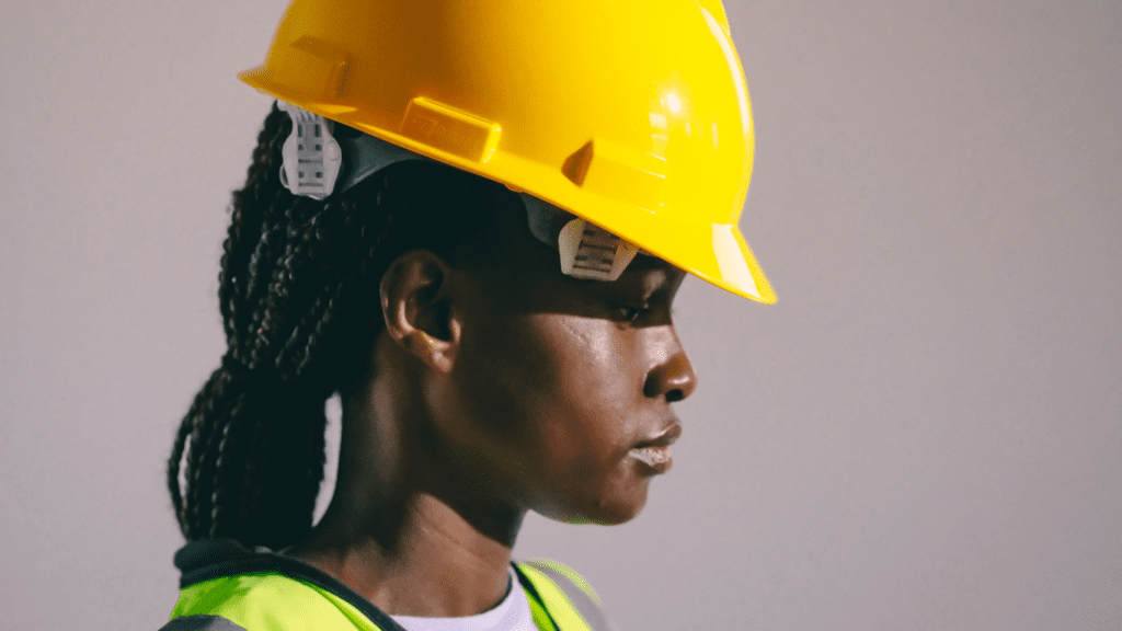 hard hat as part of PPE on woman with african hair