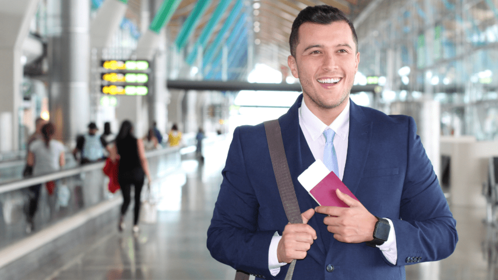 man at airport with passport and ticket
