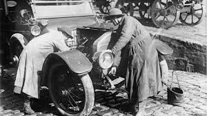 women repairing a car in world war 1