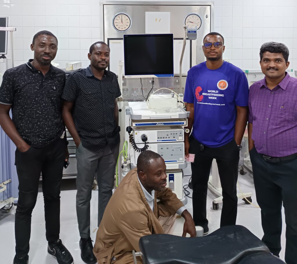 Anand Dalvi with colleagues and sterilisation equipment group photo