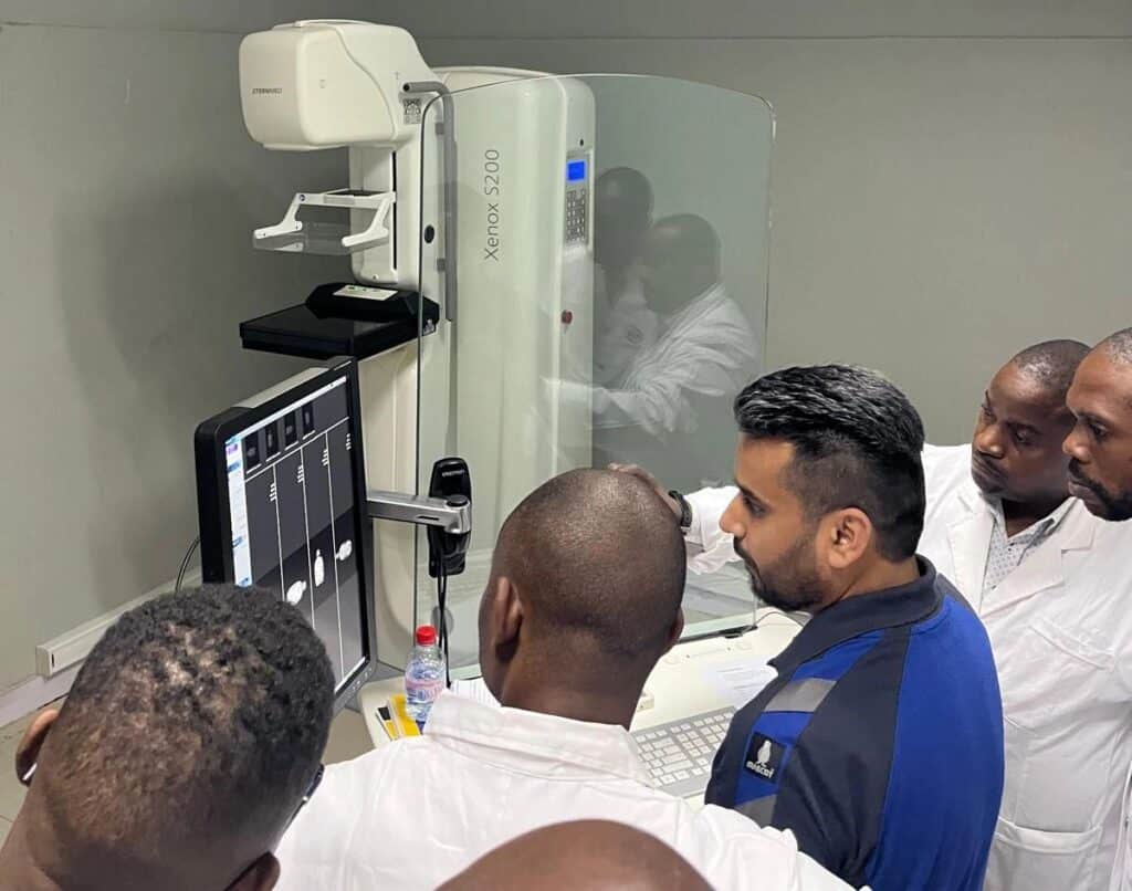 Varun Sharma training end users on equipment Xenox 5200 to improve patient care