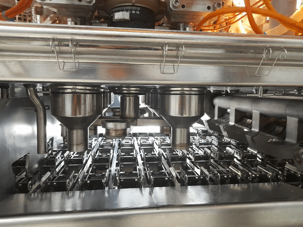 packaging equipment close up of a filler machine