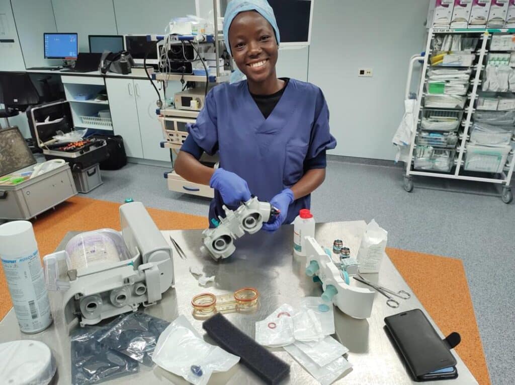 Deborah Geneugelijk Nutsugah repairing medical equipment on Mercy Ships