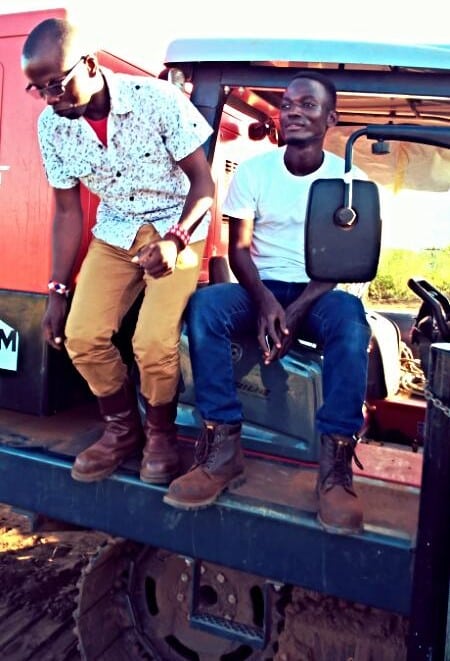 Thomas Odhiambo Okumu Engineer on site with equipment operator