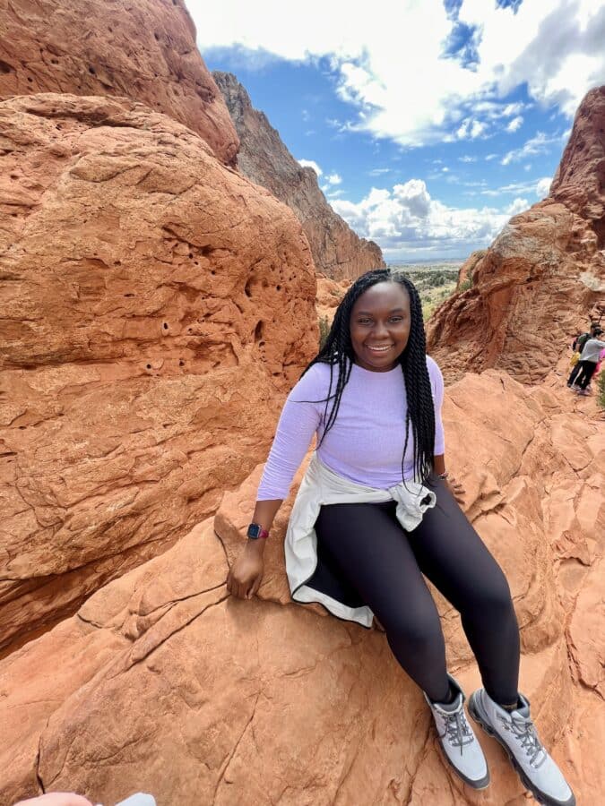 Tiffany Nungari Advanced Field Service Engineer climbing rocks