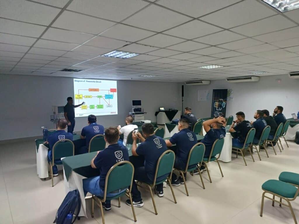 Antonio Marcos Soares Santos customer support engineer training a group of engineers