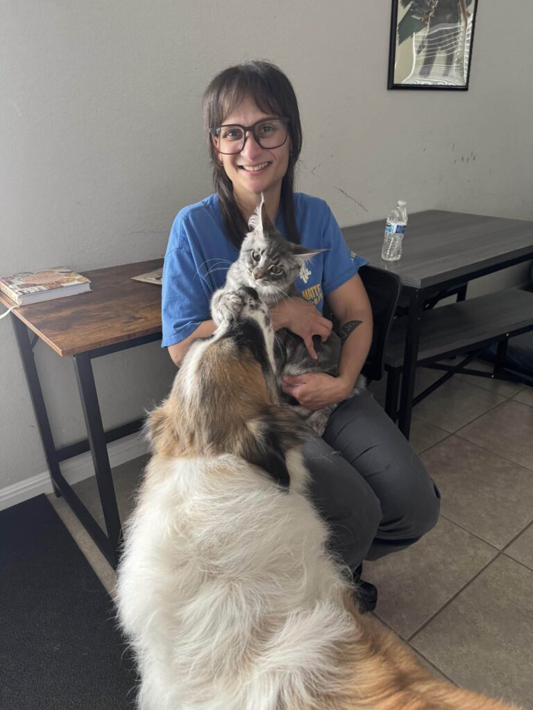 Yvette Ocasio with her dog and cat during time away from the Laboratory