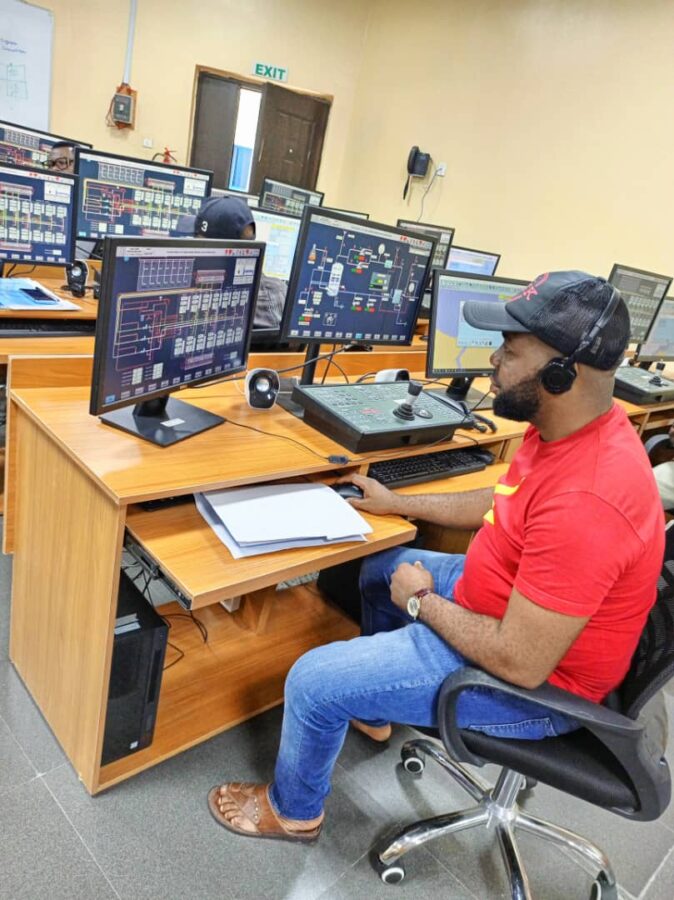 Ekele John Electrical and Electronics Engineer increasing his knowledge with further study in classroom