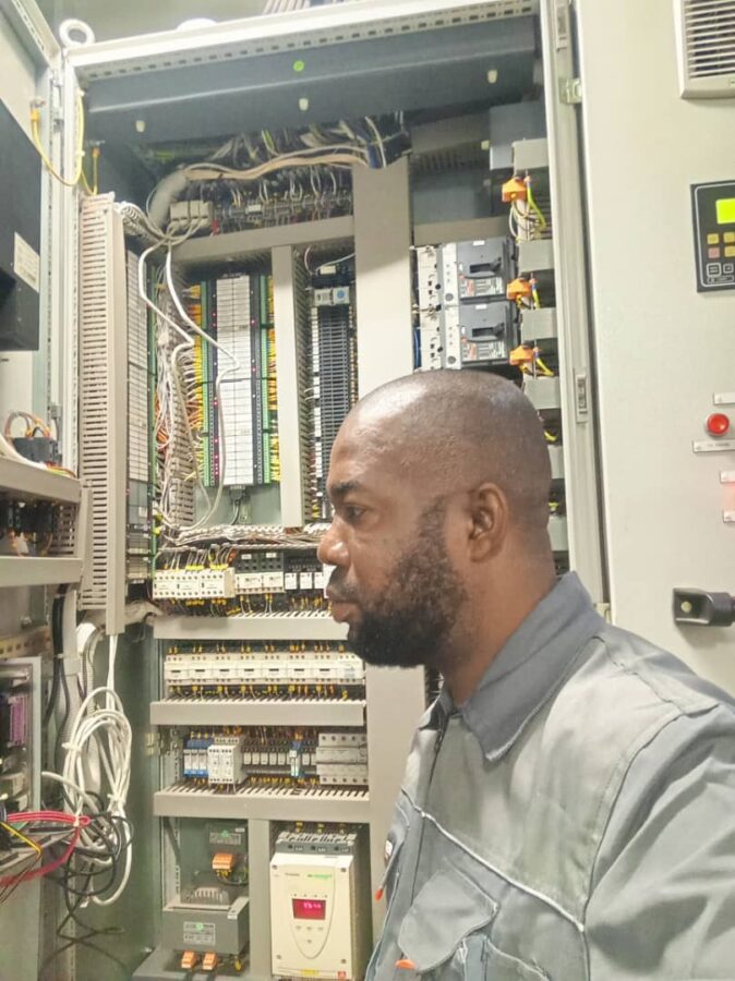 Ekele John Electrical and Electronics Engineer troubleshooting on the ship's converter panel