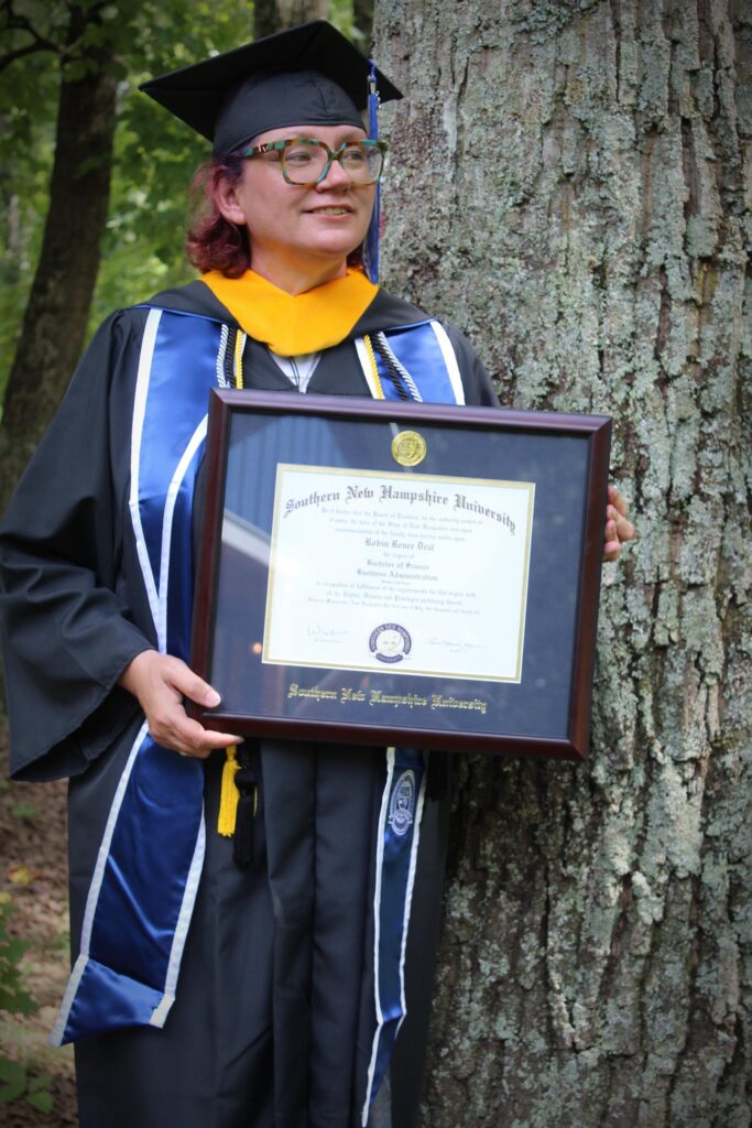 Robin Deal at graduation author of Keeping our Rivers clean handling wastewater