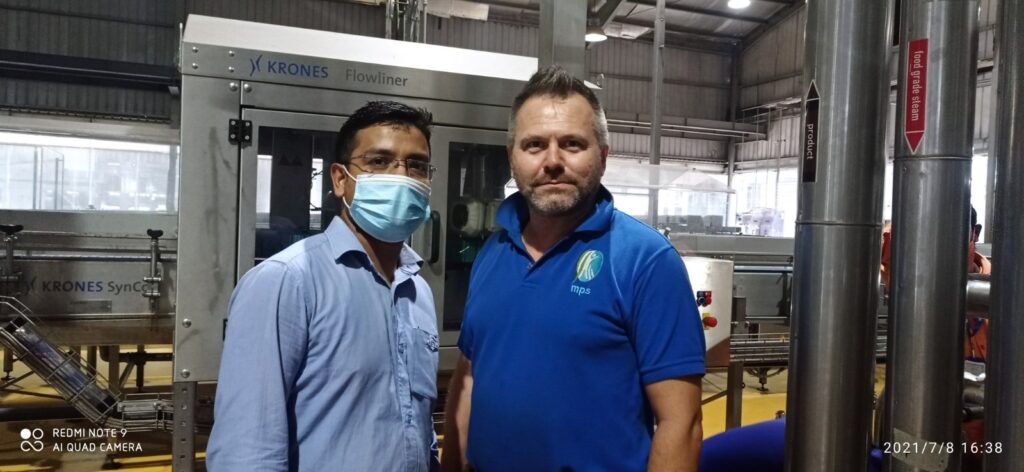 Sajib Nandy Electrical and Automation Engineer with colleague and Krones equipment